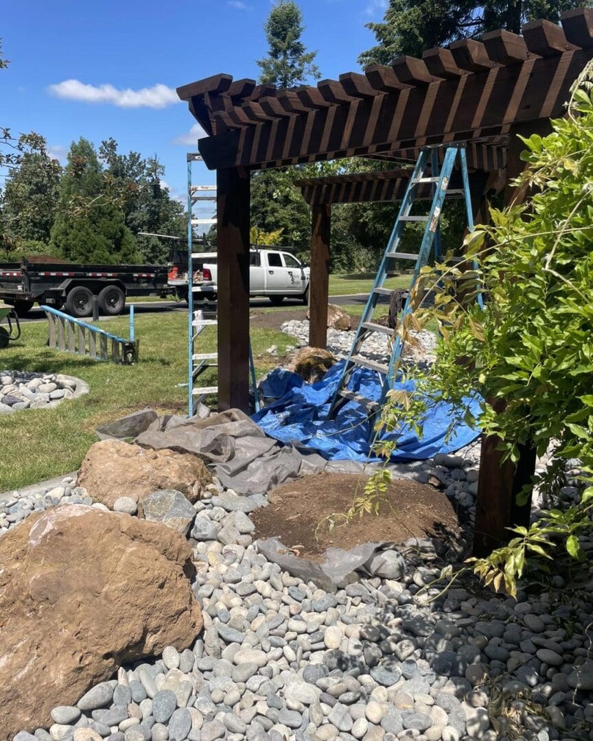 A swing set in the middle of a garden.