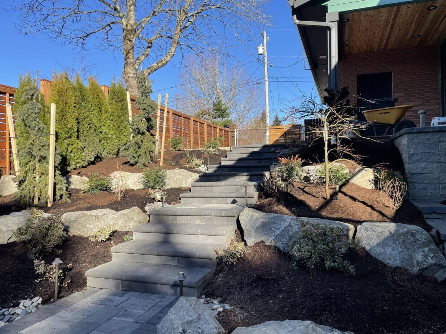 Outdoor stone steps with landscaped garden.